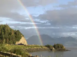 Beautiful rainbow coming from the mountain